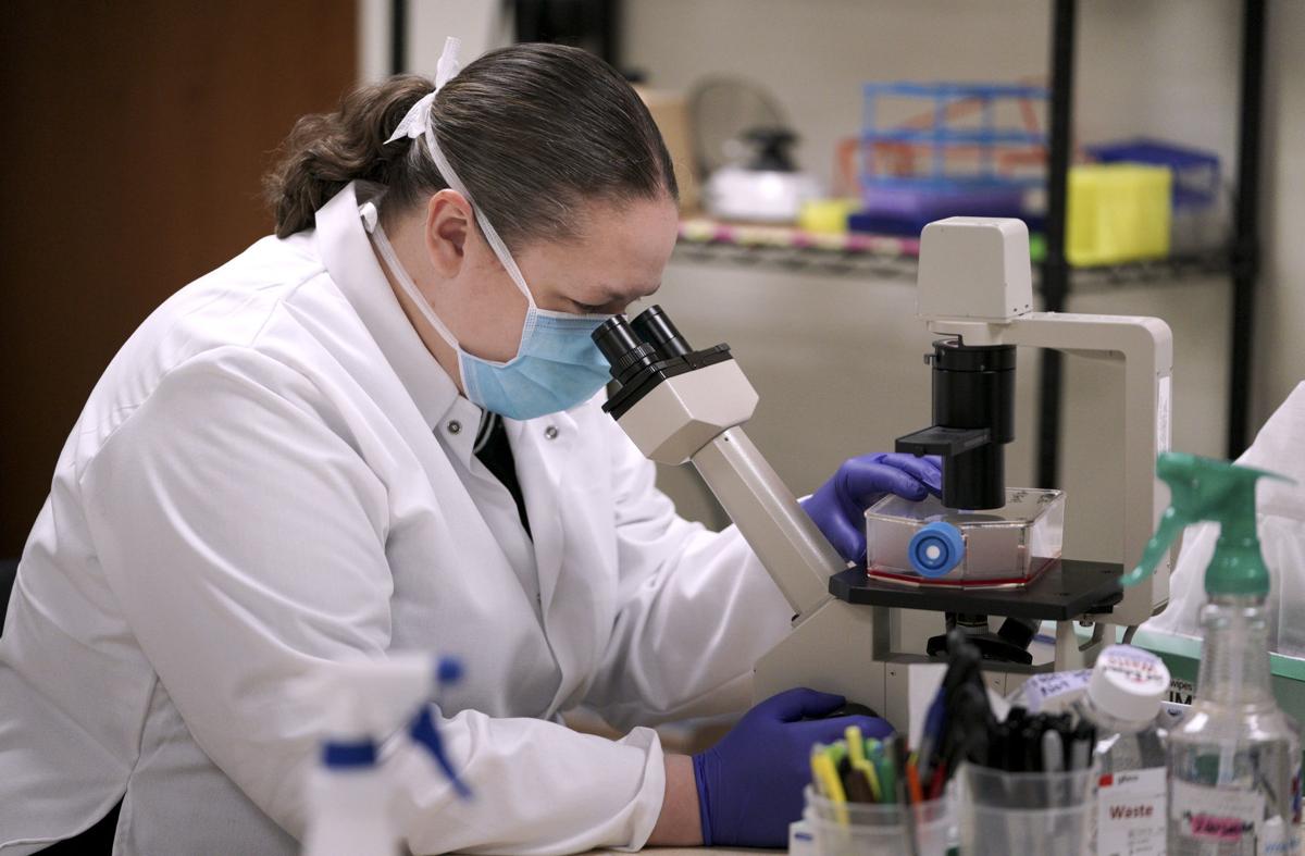Lindsay Hill-Batorski works on an experimental flu vaccine at Madison-based FluGen.