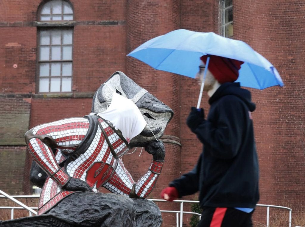 A statue of Bucky Badger on UW-Madison's campus wears a makeshift face mask. The UW Board of Regents passed a mask requirement at a meeting Thursday.   JOHN HART, STATE JOURNAL