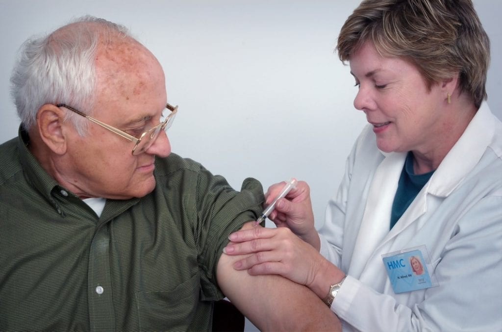 doctor giving vaccine