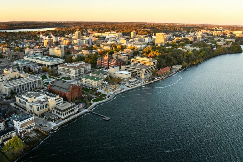 Lake Mendota and the University of Wisconsin–Madison campus, including Alumni Park and the Memorial Union Terrace, are pictured in the morning light. PHOTO: BRYCE RICHTER