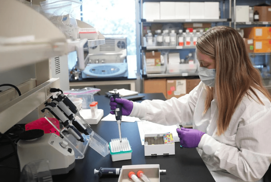 To detect DNA fragments from tumors in blood, labs need to amplify DNA from samples. Research associate Breanna Richard prepares samples for amplification tests at Exact Sciences. KAYLA WOLF, STATE JOURNAL