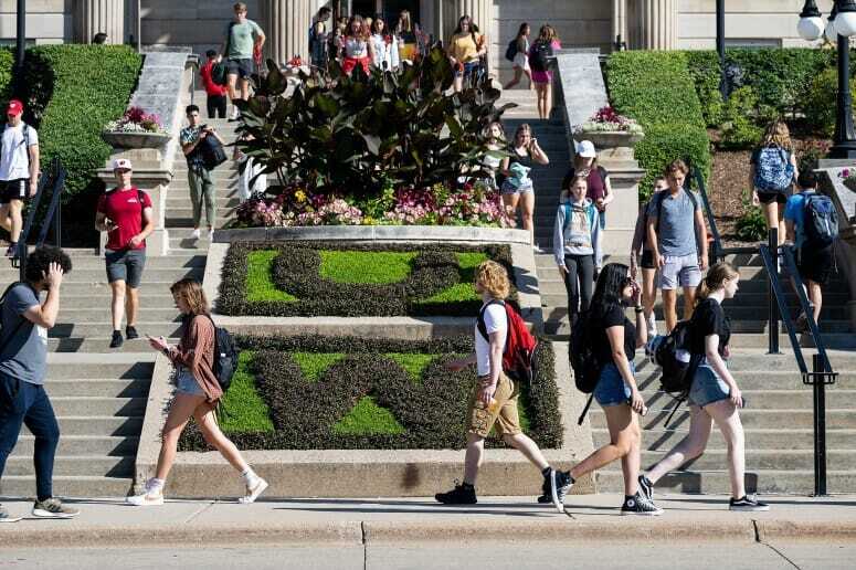Students walk past the flower bed at Agricultural Hall on the first day of class of fall semester, Sept. 7, 2022. PHOTO: JEFF MILLER