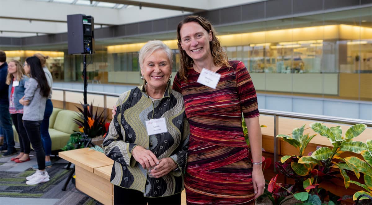 Carol Skornicka (left) and Melissa Skala (right) celebrate together during an event honoring the new Carol Skornicka Chairship bestowed to Skala in October 2022 in the Discovery Building.