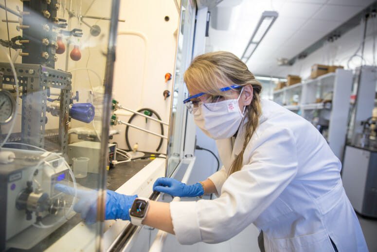 Canan Sener, scientist in the Great Lakes Bioenergy Research Center, prepares an experiment in her lab. Sener’s research focuses on turning plant material into valuable products. GREAT LAKES BIOENERGY RESEARCH CENTER
