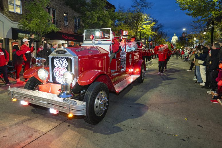 The Bucky Wagon leads the way for the UW Spirit Squad during the Homecoming Parade along State Street. Photo: Bryce Richter